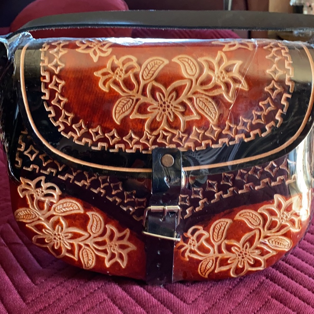 Black and brown hand carved purse